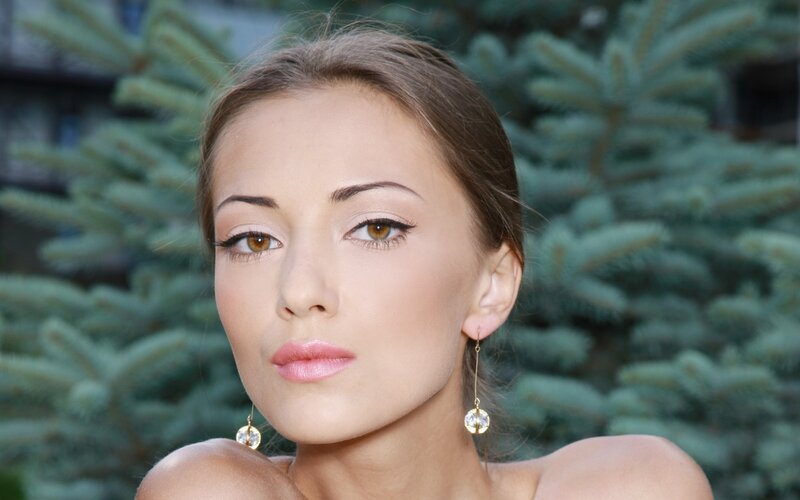 woman with earrings outdoors