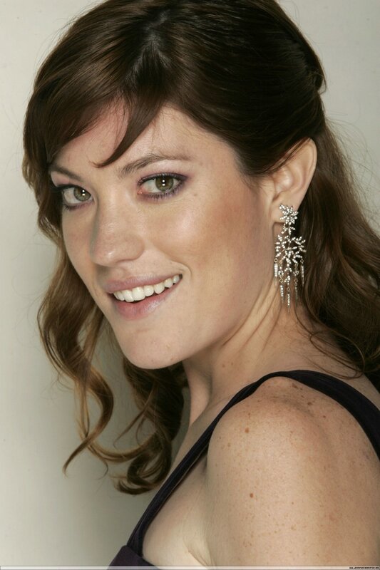 woman with earrings smiling