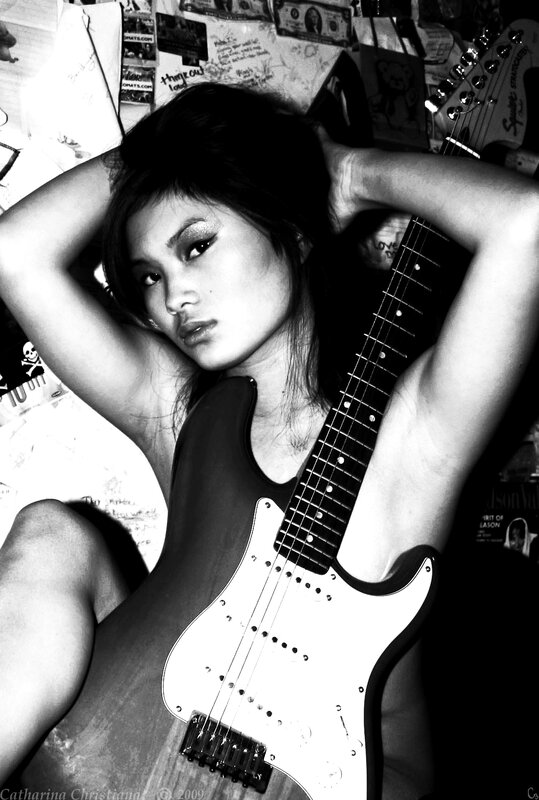 Woman with electric guitar