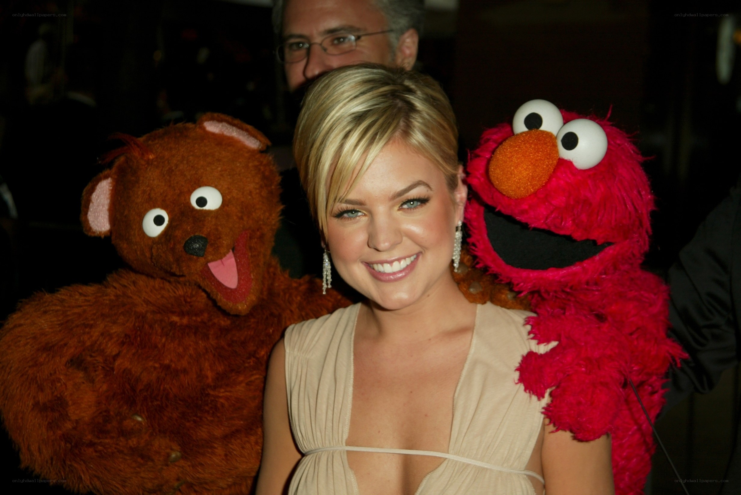 Woman with Elmo and a bear puppet