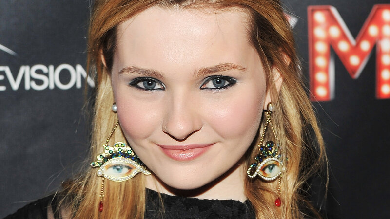 Woman with Eye Earrings