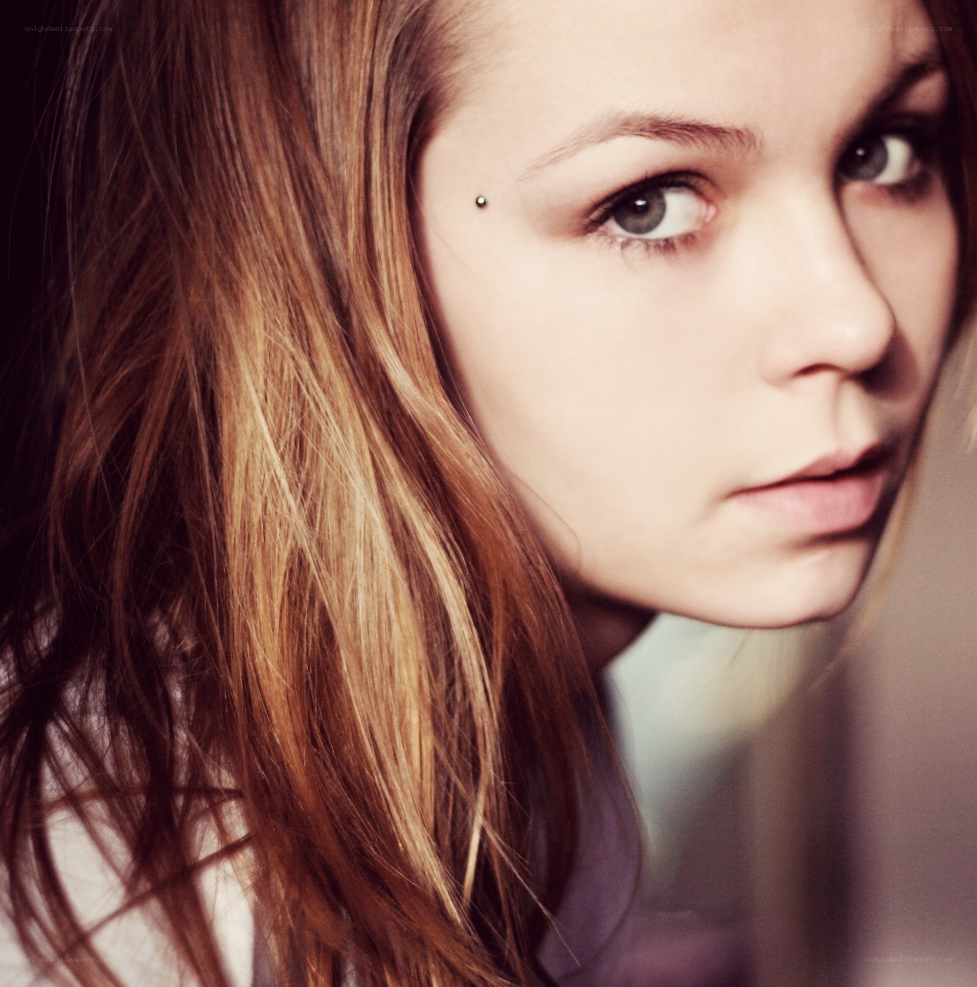 woman with eyebrow piercing