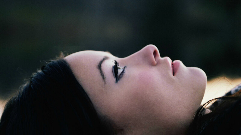 woman with eyes closed