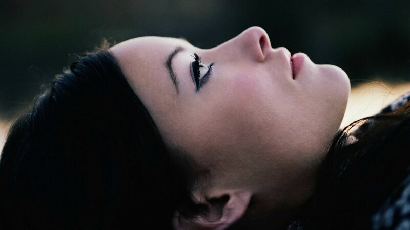 woman with eyes closed