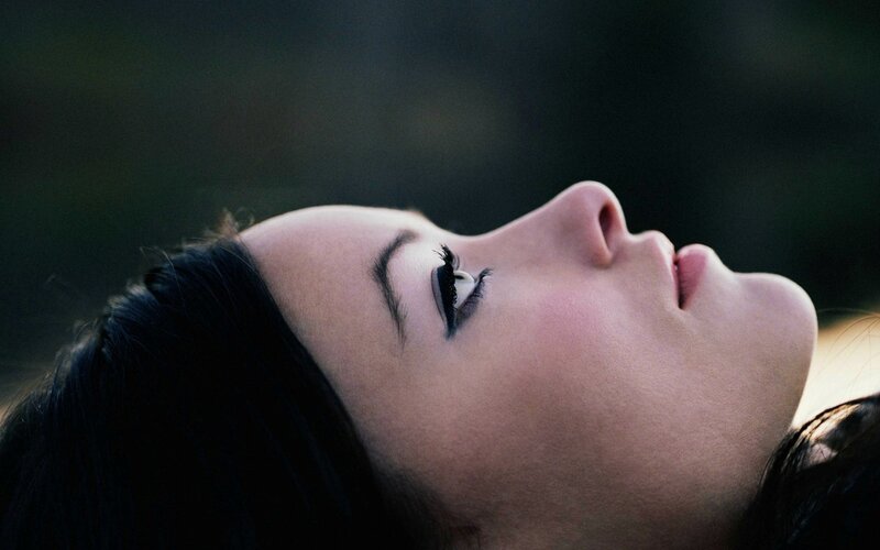 woman with eyes closed