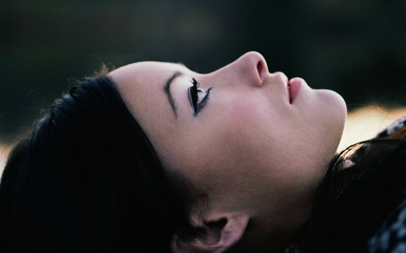 woman with eyes closed