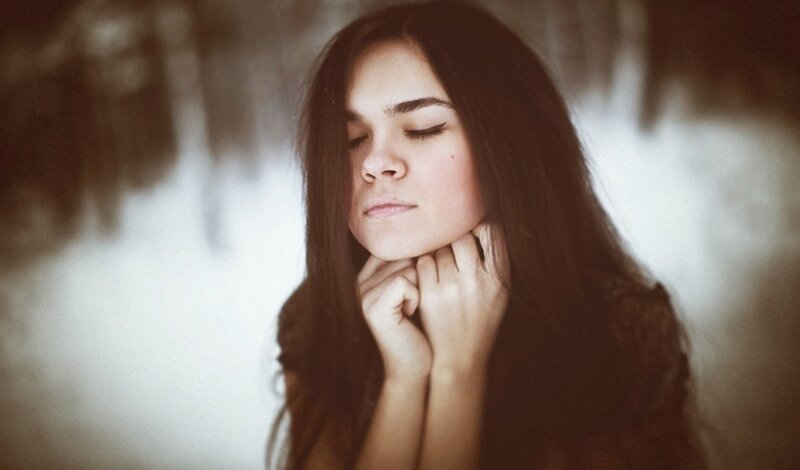 woman with eyes closed in thought