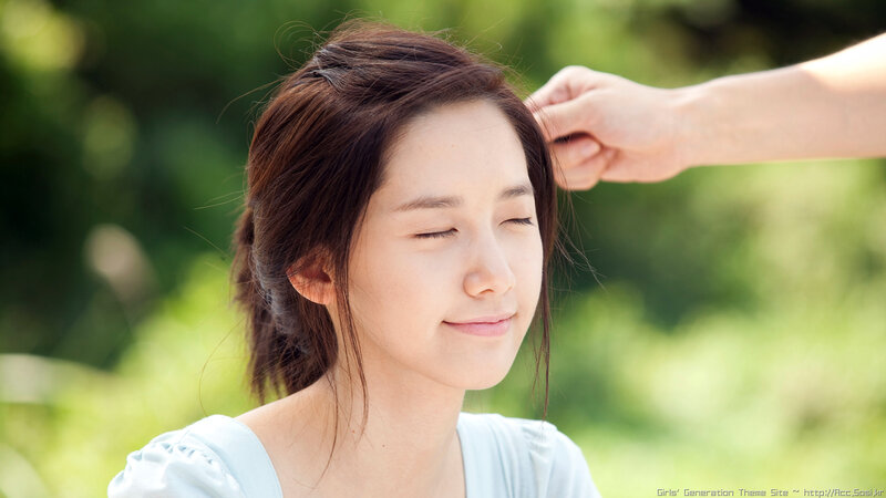 woman with eyes closed outdoors