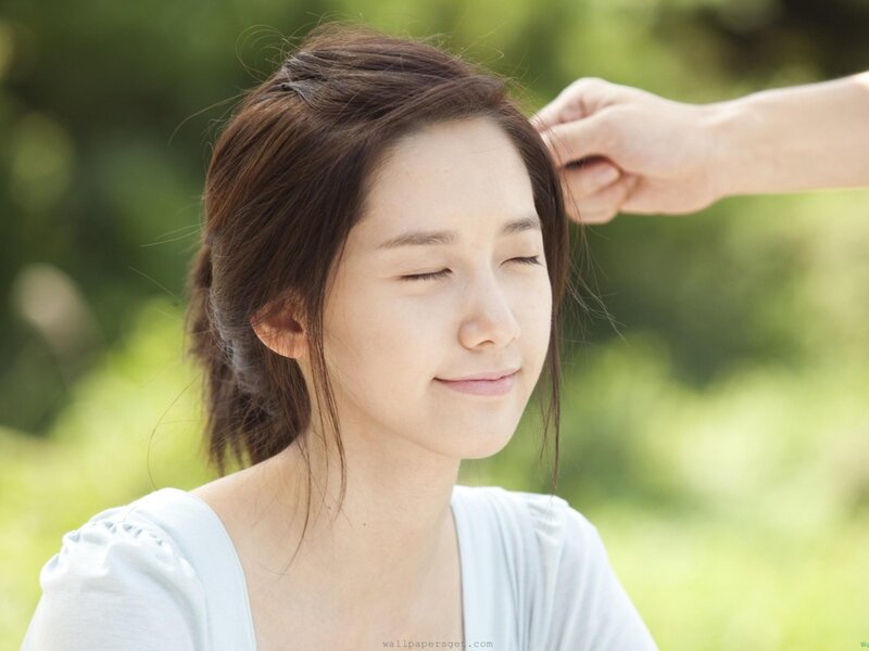 woman with eyes closed outdoors