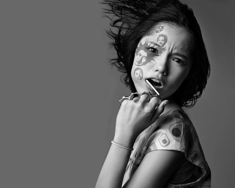 woman with face art and knuckle duster