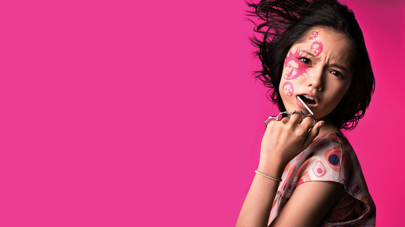 woman with face paint and brass knuckles