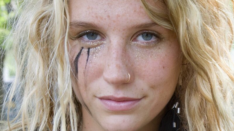 woman with face paint and glitter