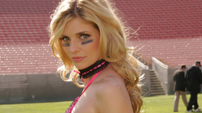 woman with face paint at stadium