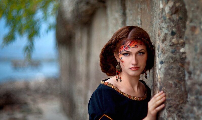 Woman with Face Paint — Brown, Dramatic, Photograph, Stone Wall