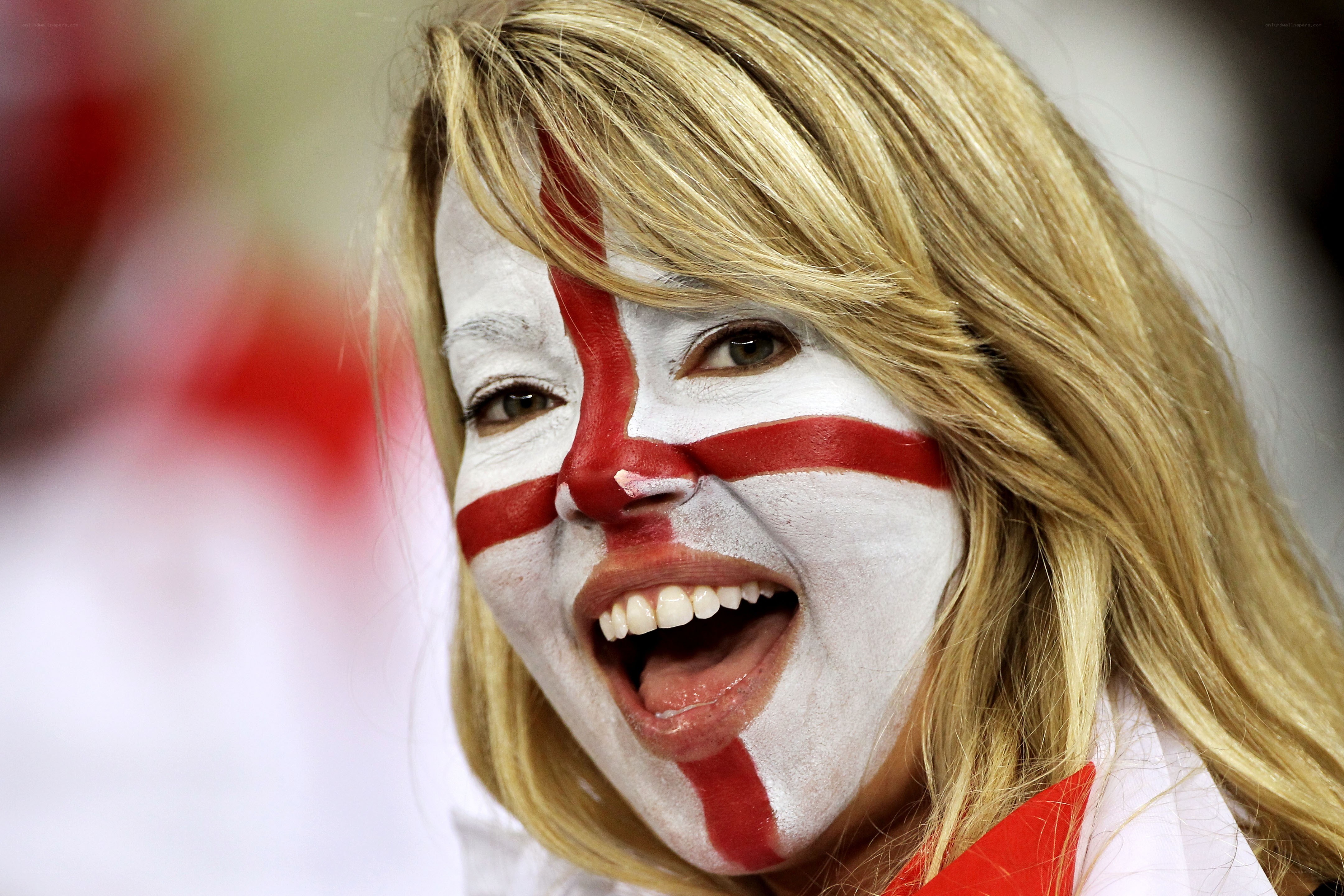 woman with face paint cheering