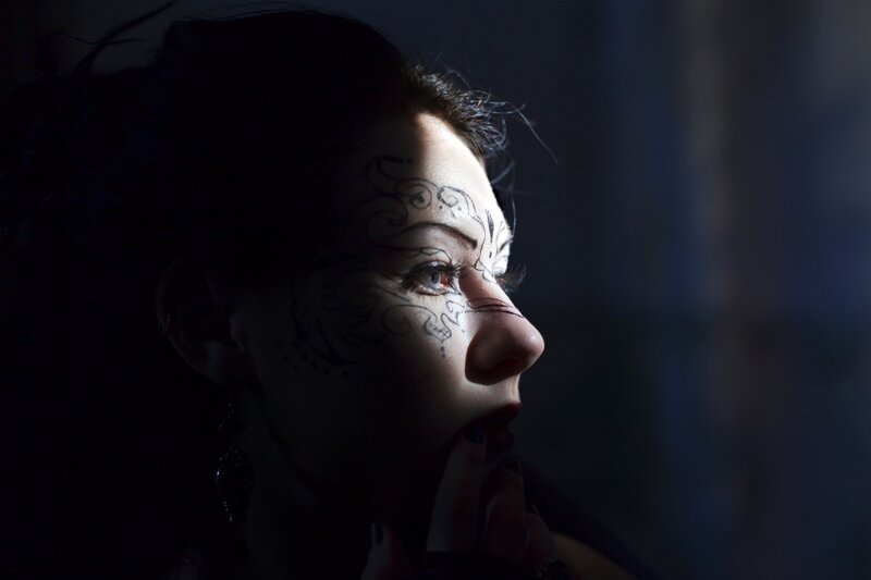 woman with face paint in profile