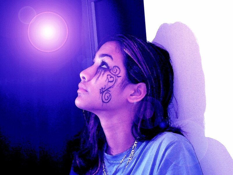 woman with face paint looking up