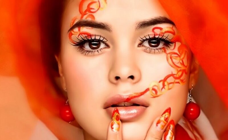 Woman with Face Paint — Orange, Dramatic