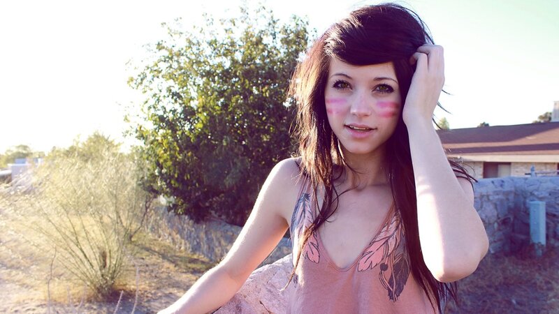 woman with face paint outdoors