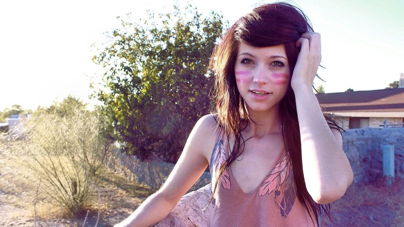 woman with face paint outdoors