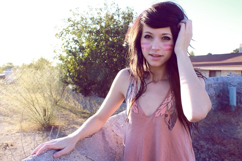 woman with face paint outdoors