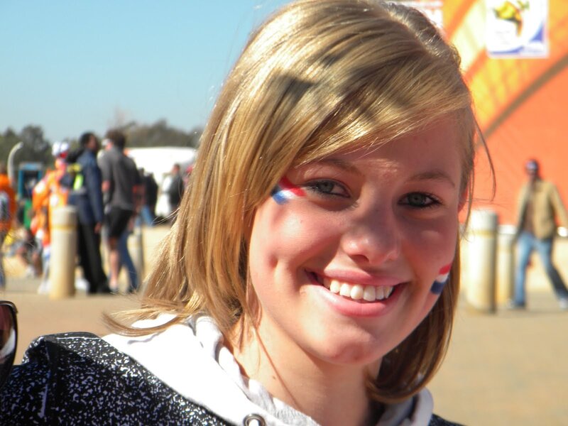 woman with face paint smiling