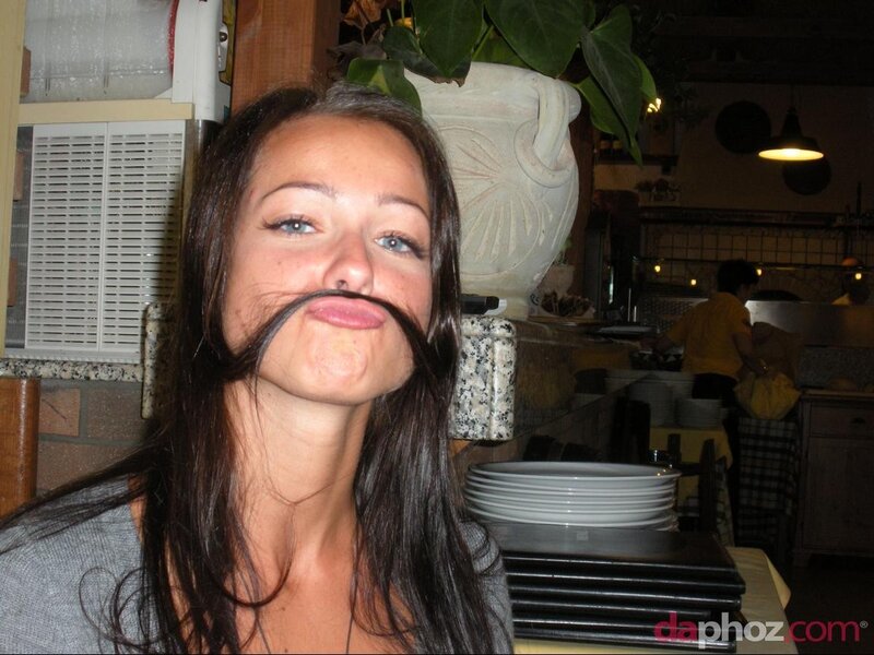 woman with fake mustache at restaurant