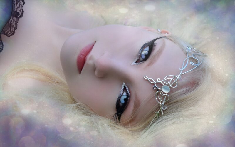 woman with fantasy makeup and crown