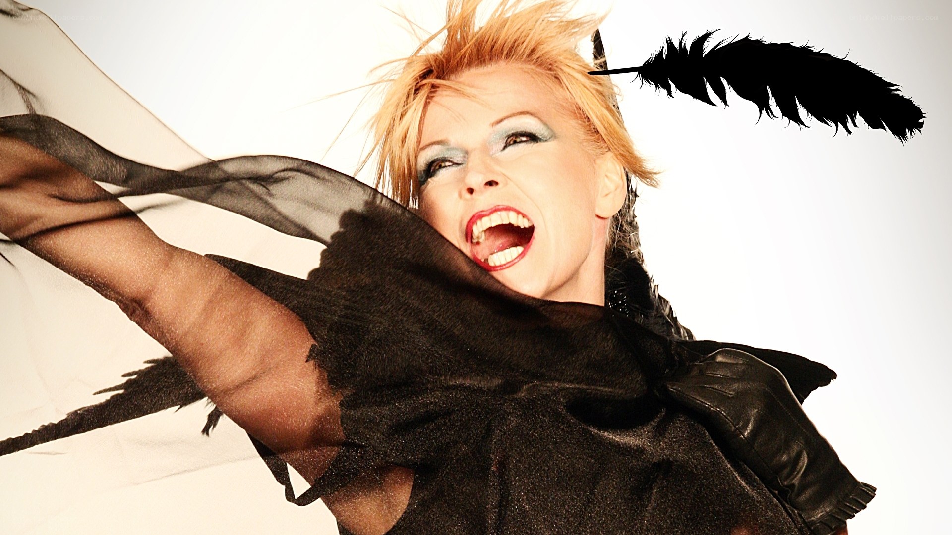 woman with feather and black scarf