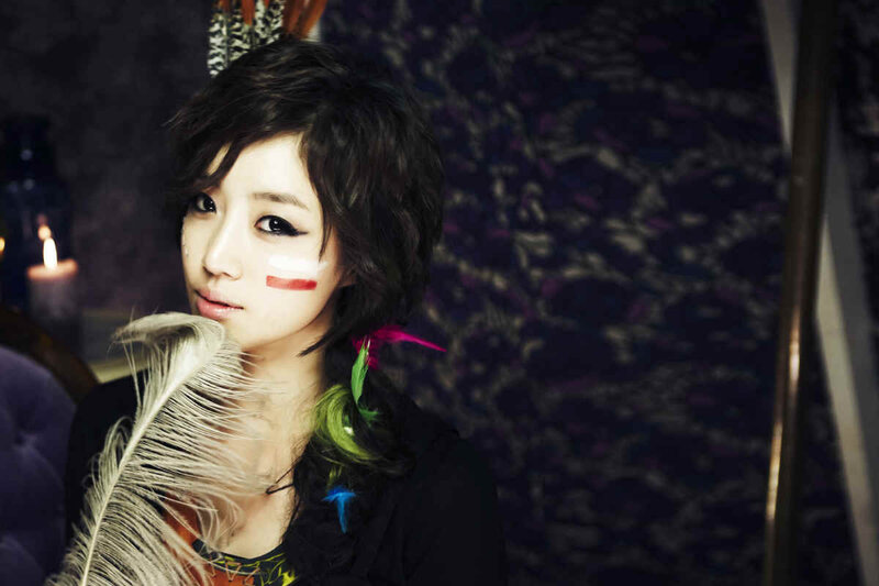 woman with feather and face paint