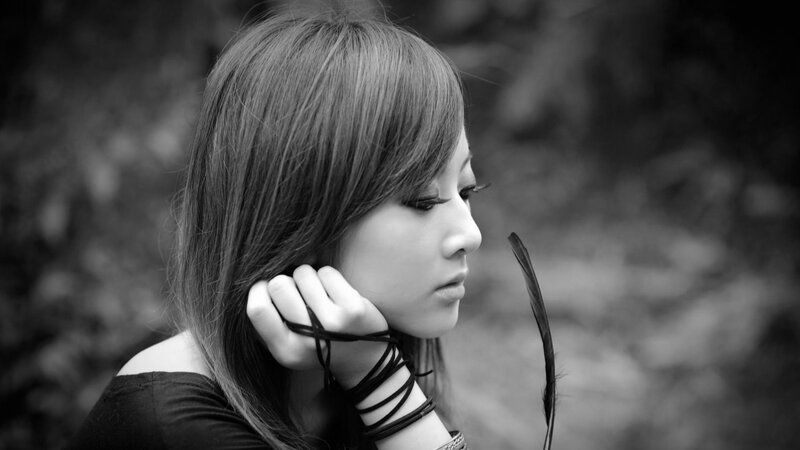 Woman with Feather — Black, Contemplative