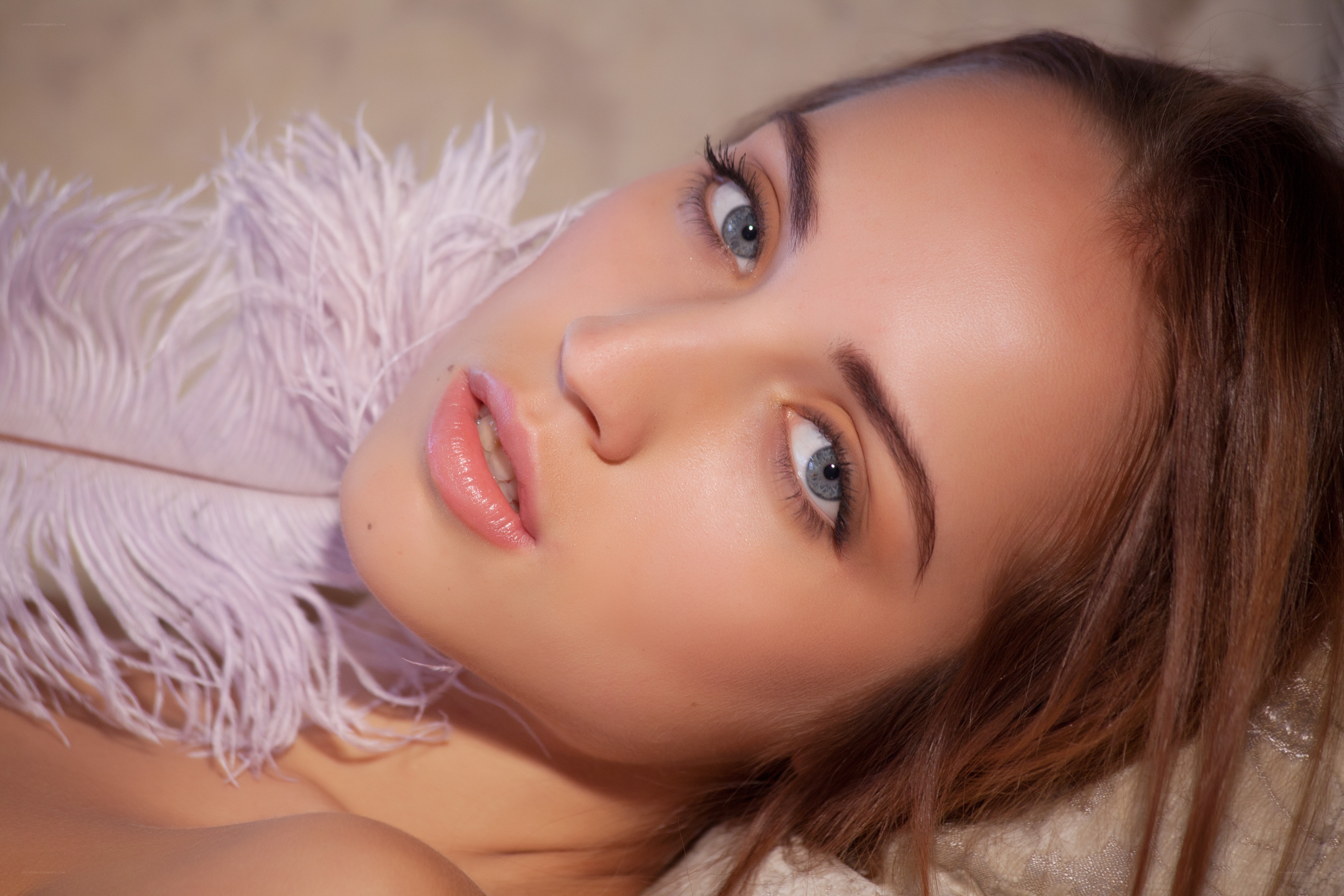 woman with feather close-up