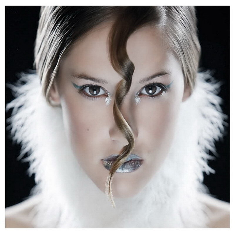 woman with feather collar and silver makeup