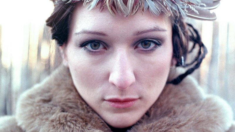 woman with feather crown