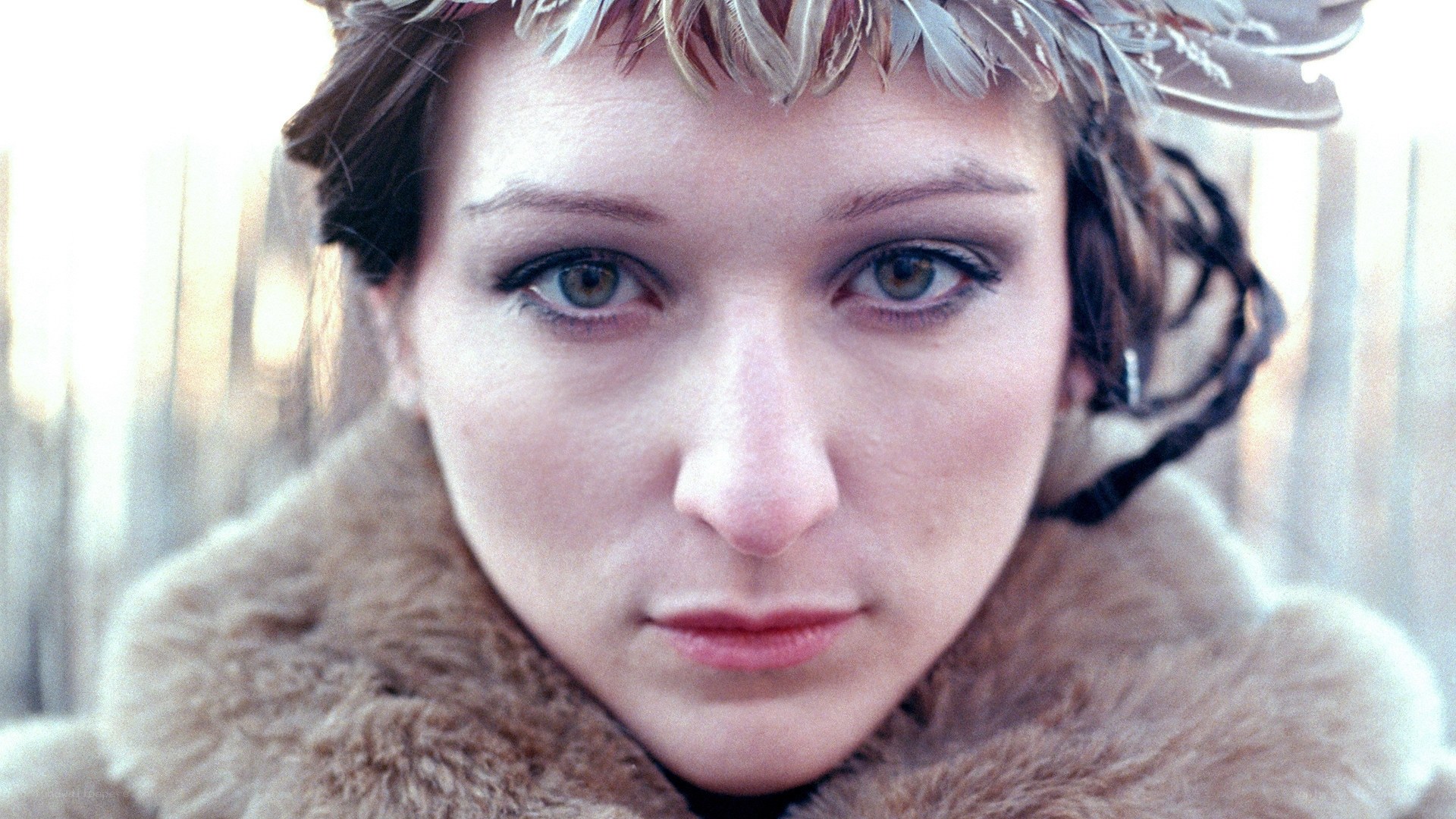 woman with feather crown