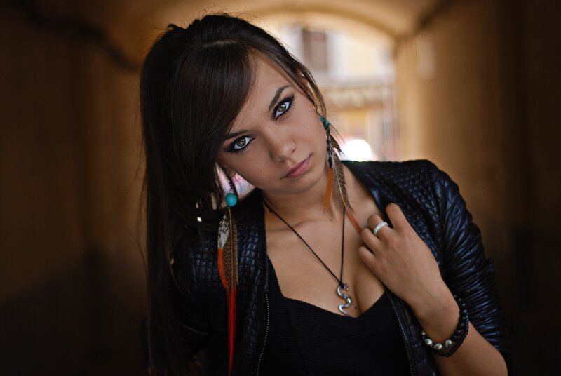 Woman with Feather Earrings — Black, Dramatic, Photograph