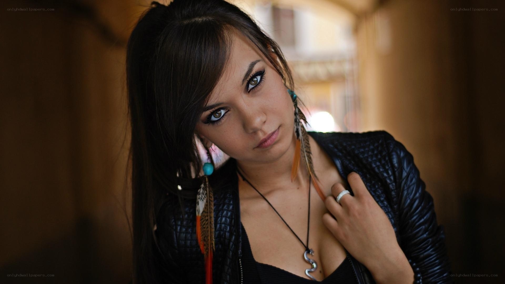 woman with feather earrings