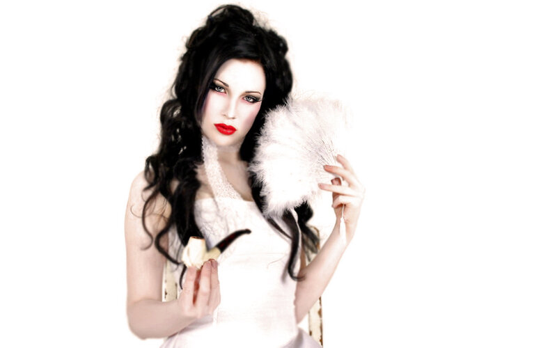 woman with feather fan and pipe