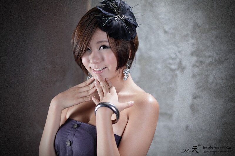 woman with feather hair accessory