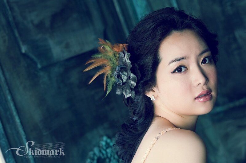 woman with feather hair accessory