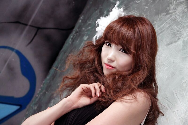 woman with feather hair accessory