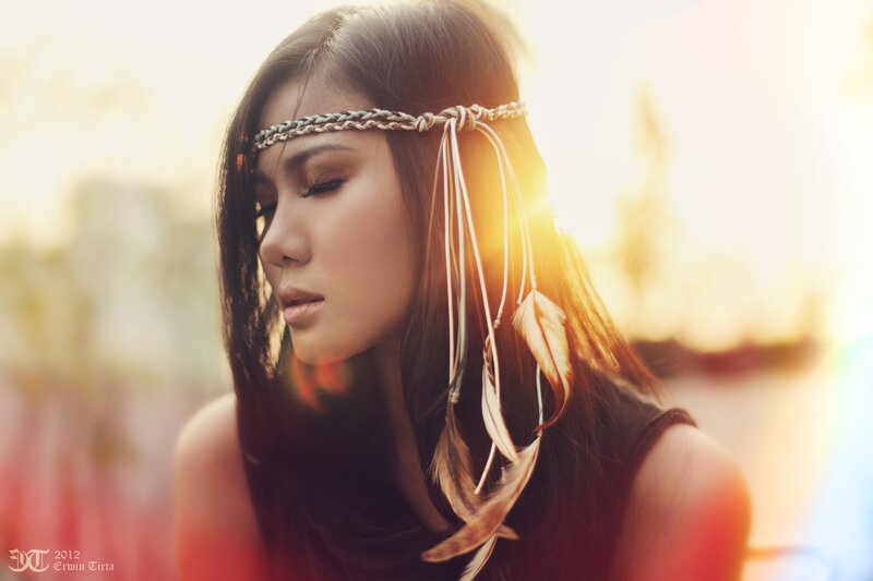 woman with feather headband