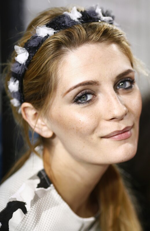 woman with feather headband
