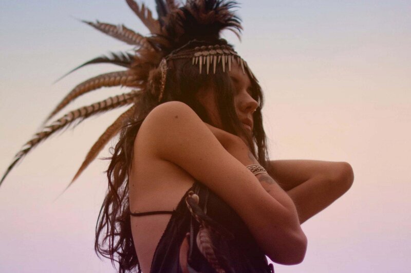 woman with feather headdress
