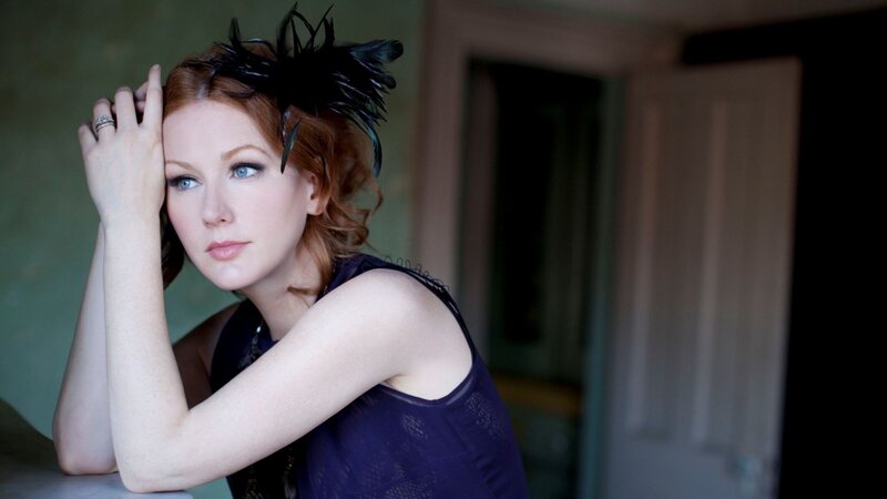 woman with feather headpiece