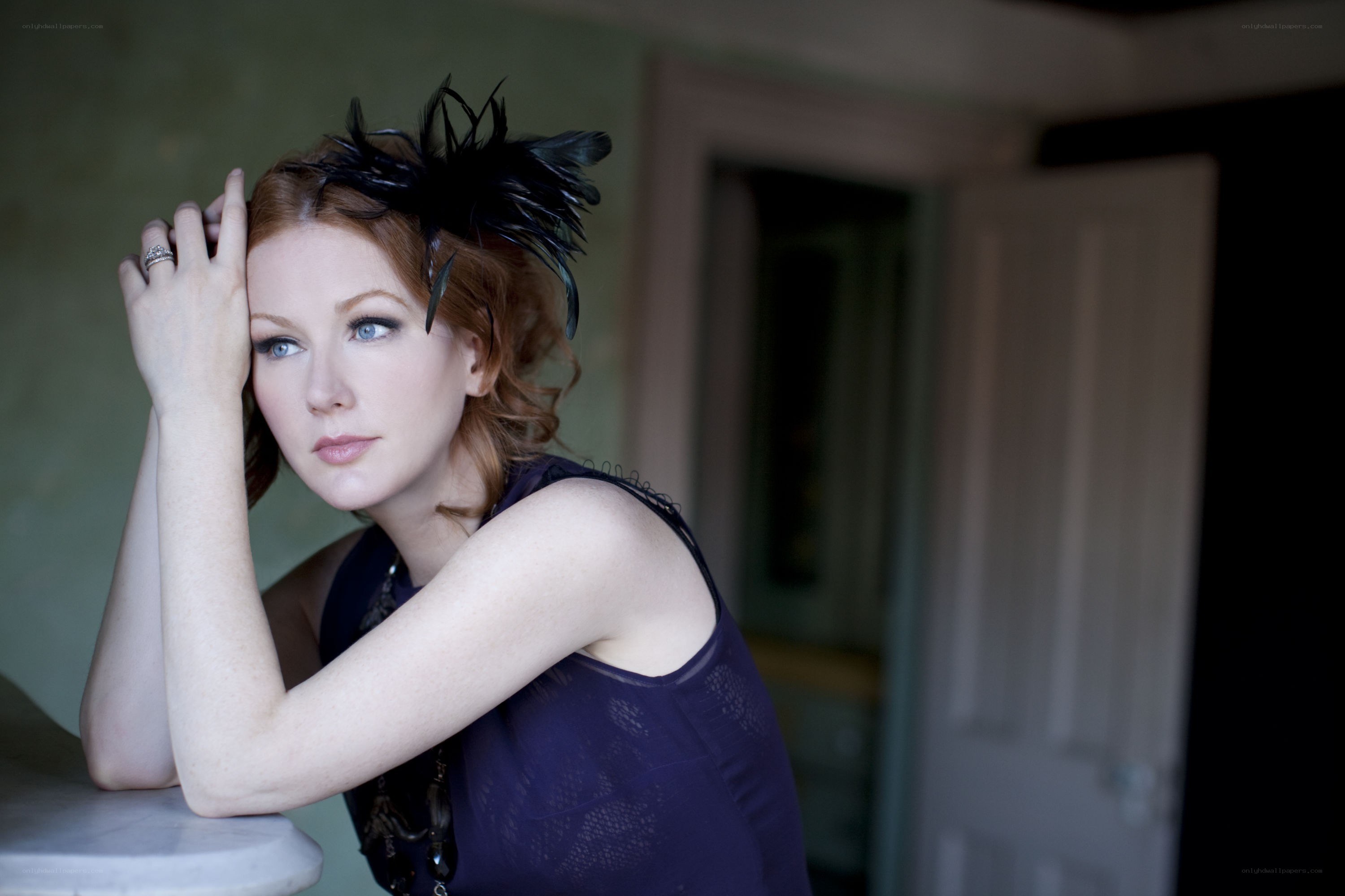 woman with feather headpiece
