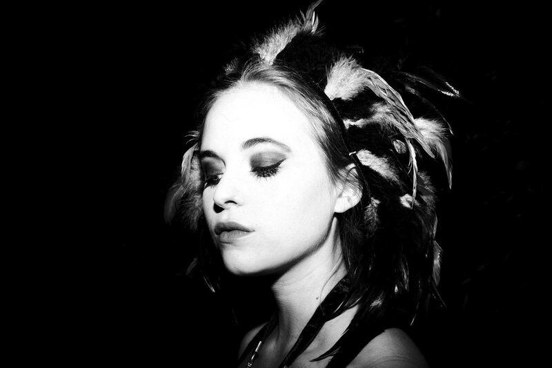 woman with feather headpiece