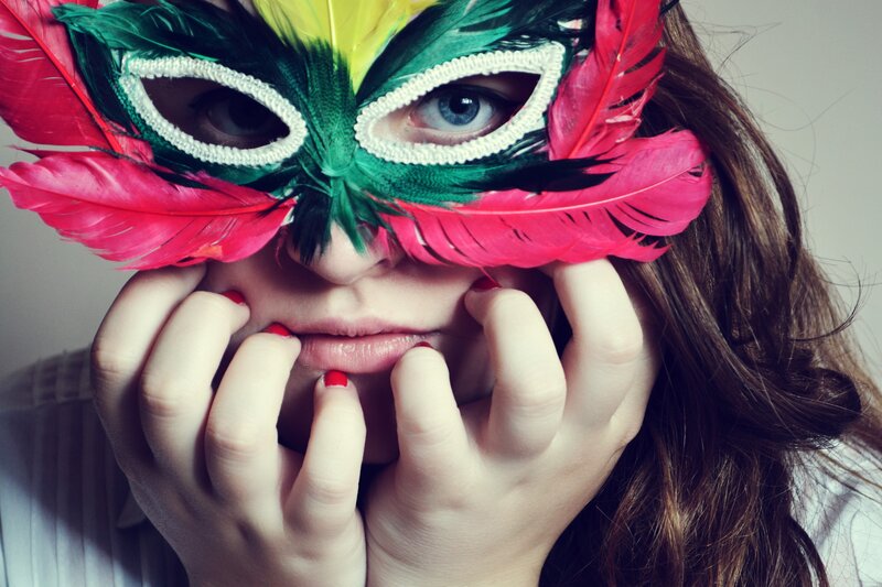 woman with feather mask