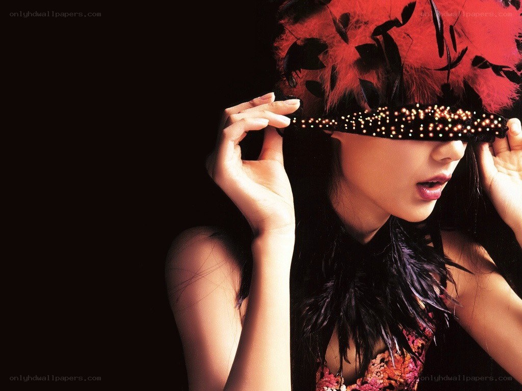 woman with feather mask