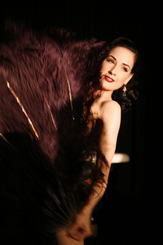 woman with feathered fan